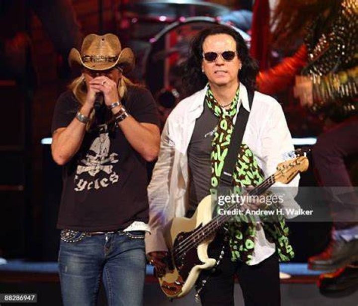Bret Michaels and Bobby Dall from Poison with their respective ladies