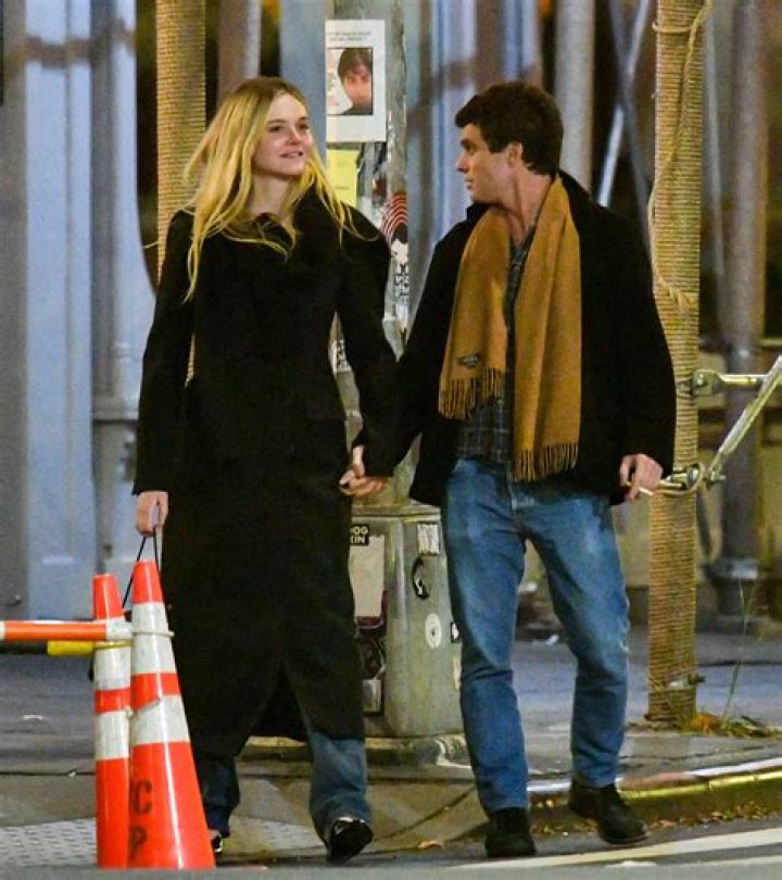 Elle Fanning, 25, holds hands with Rolling Stone CEO Gus Wenner, 33