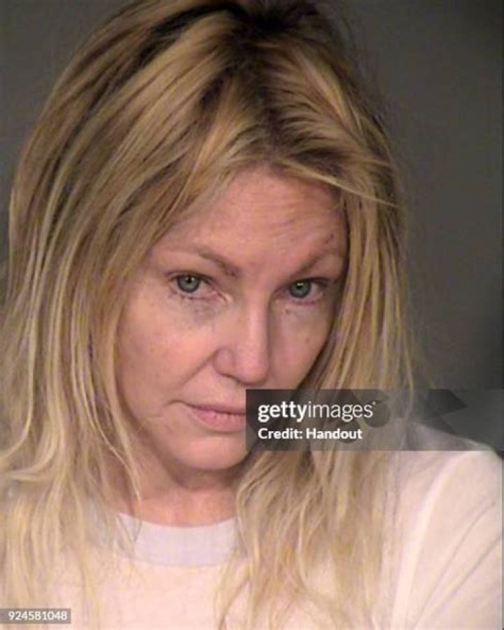 Locklear is seen in a police booking photo after her arrest on two counts of misdemeanor battery on a police officer and EMT in June 2018