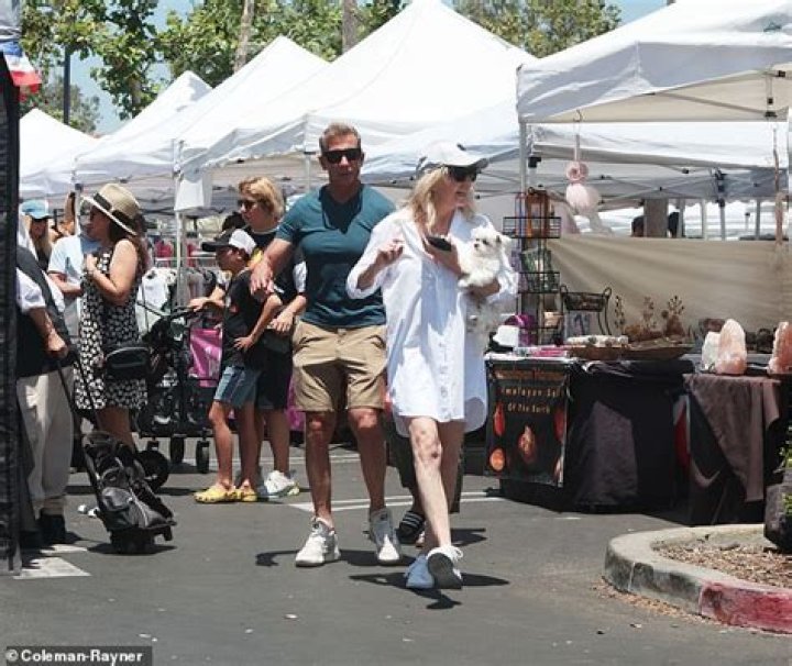 Locklear was smiling as she browsed produce and the various craft stalls
