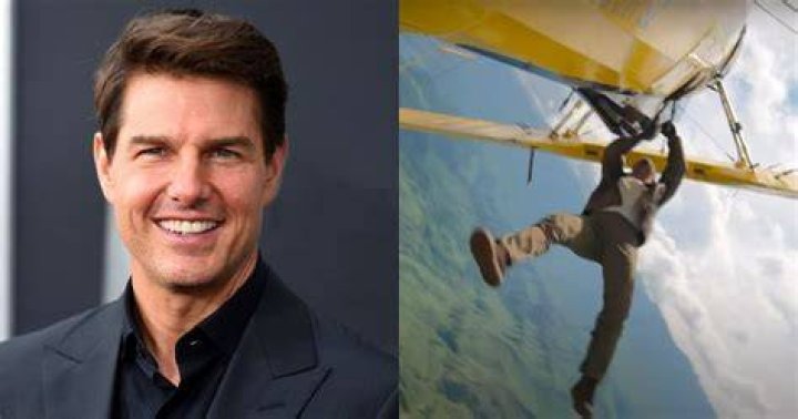 Tom Cruise pilots his own helicopter and waves to fans as shooting