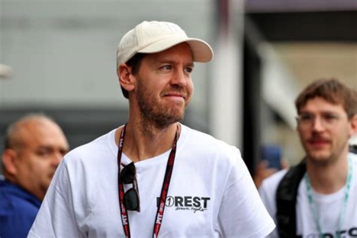 Watch Sebastian Vettel pays Daniel Ricciardo special visit at Silverstone test